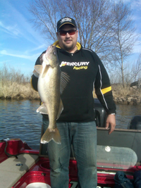 image of Jason Muche with giant Walleye