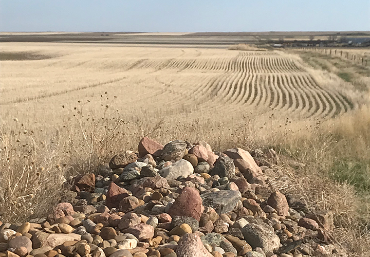 image of isolated rock pile in expansive flat field