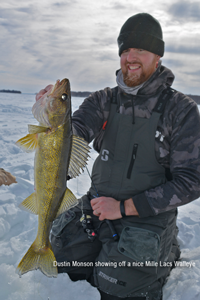 image of Dustin Monson with mille lacs walleye