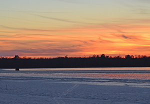 ice shelter at sunset on Moose Lake