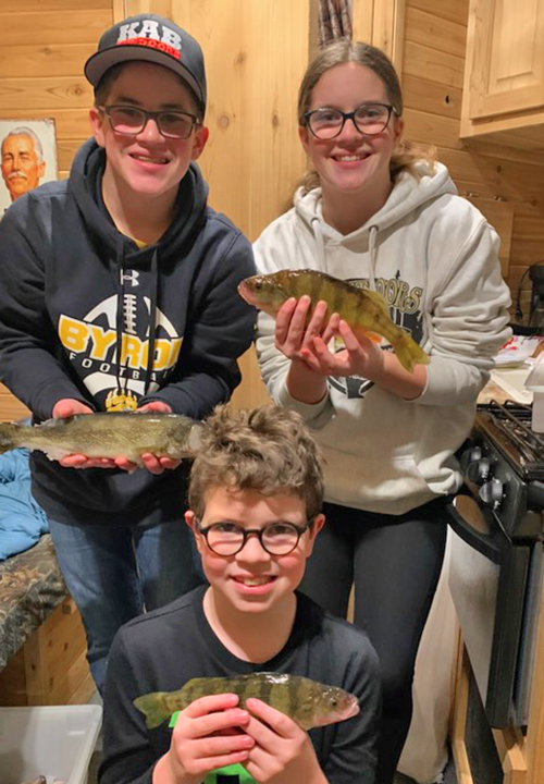 image of Natalie, Oliver and Andy with mixed bag of walleye and perch