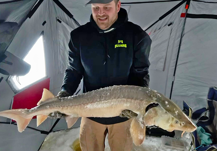 image of Patrick Everson holding big Sturgeon caught near Duluth MN 