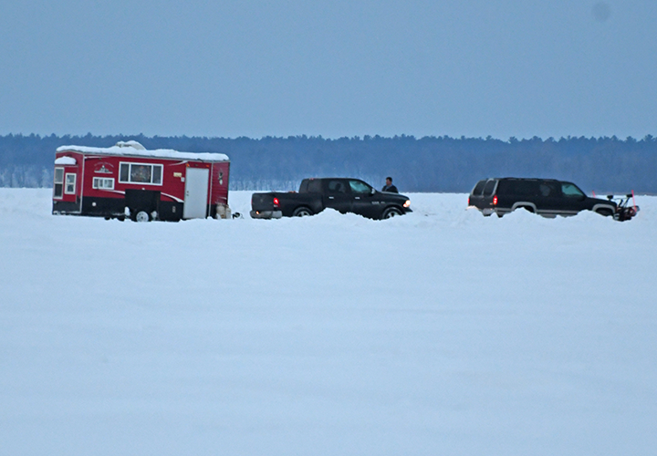 image of High Banks Resort plow truck opening up an ice fishing spot for weekend customers