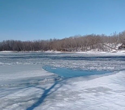 image of the rainy river at franz jevne boat ramp on march 28, 2022