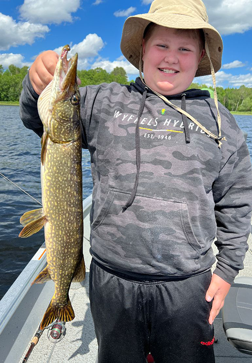 image of Brice Demuth holding nic size northern pike