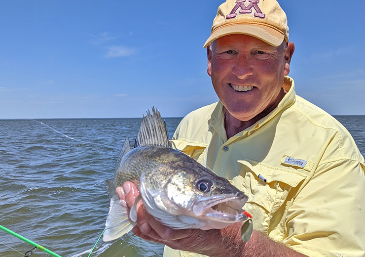 image of fishing guide Jeff Sundin holding a nice walleye caught on upper red lake