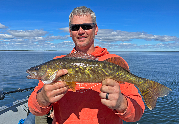 image of Andy with nice protected slot size walleye on Winnie