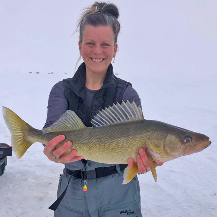 image of woman holding a big walleye caught on Lake of the Woods
