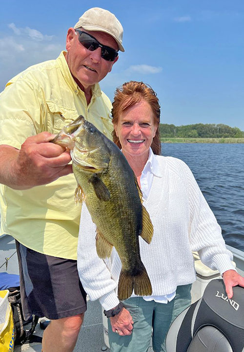 image of Janet Christensen with largemouth bass