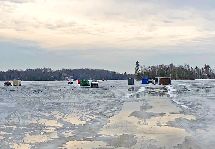 image of vehicles on the ice at Trout Lake near Coleraine Minnesota