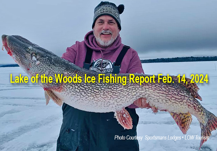 image of ice fisherman holding huge northern pike caughtr on Lake of the Woods