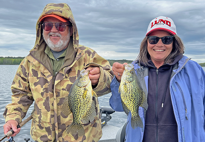 image of Ken Seufert and the Hippie Chick with a pair of nice crappies caught near Grand Rapids