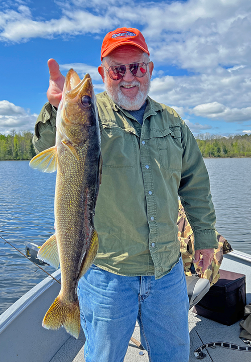 image of Ken Seufert holding big walleye he caught near Grand Rapids MN 