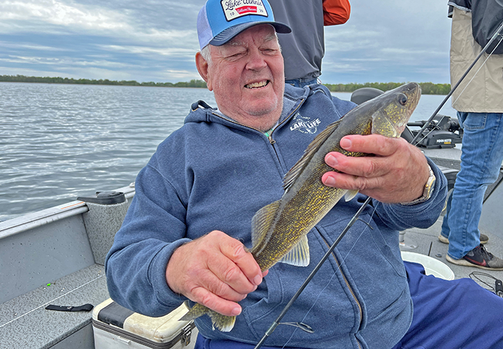 image of Virgil Krug holding a nice winnie walleye