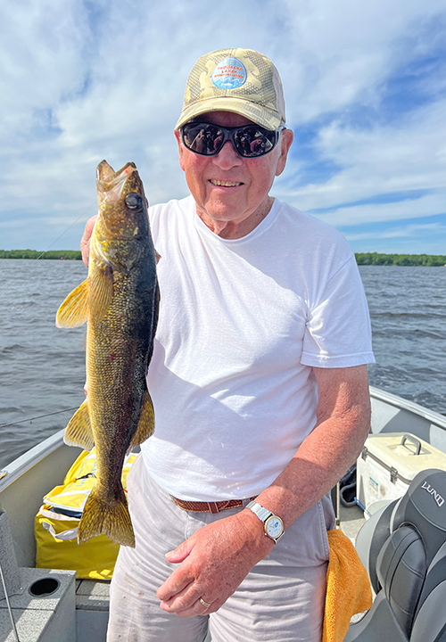 image of Jim Gandy holding nice walleye caught using a wiggle worm