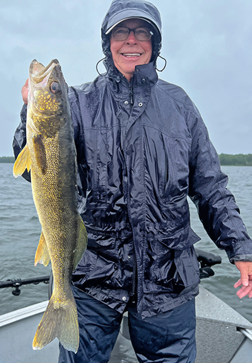 image of Stew Wilson with nice walleye caught on Lake Winnie