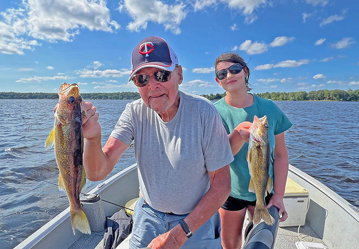 image of Carl Bergquist and Katie (Sundin) Marchev with a walleye double on Big Sandy