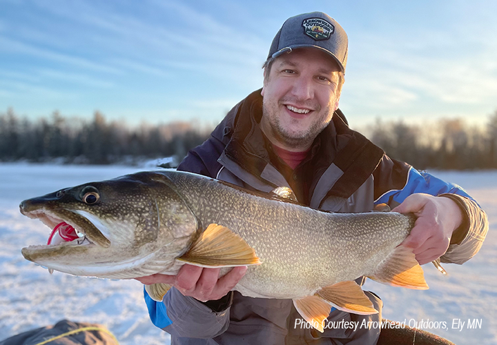 image of Steve Rennenberg holding a big lake trout