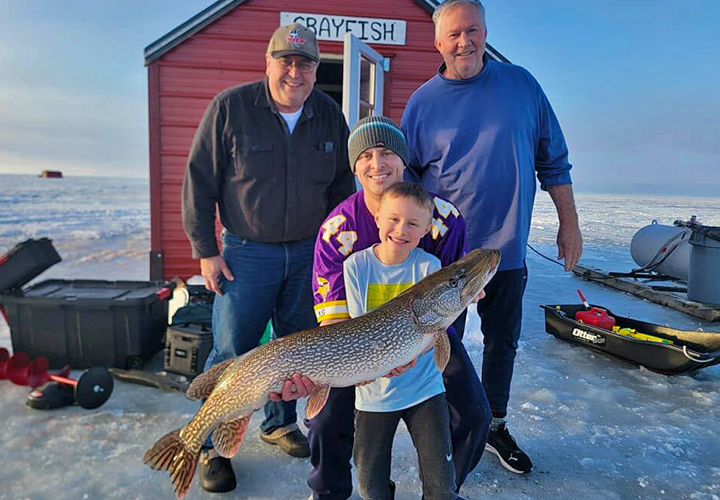 image of family ice fishing at Arneson's Resort on Lake of the Woods