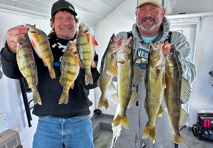 image of Tim "Wingnut" Hill and Roger Cormier with nice catch of walleyes and perch