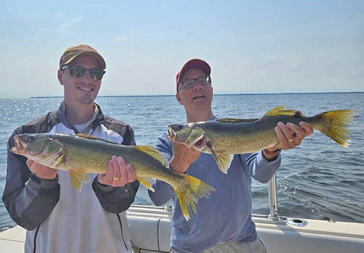 umage of 2 fishermen with big walleyes caught on Lake of the Woods