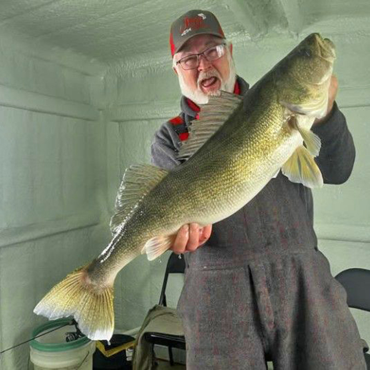 image of Tom Briggs with huge 32.5 inch walleye caught at R&R Lodge at Lake of the Woods