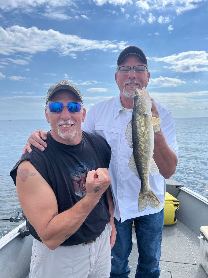 image of erik and phil goettl with nice walleye caught on lake Winnibigoshish