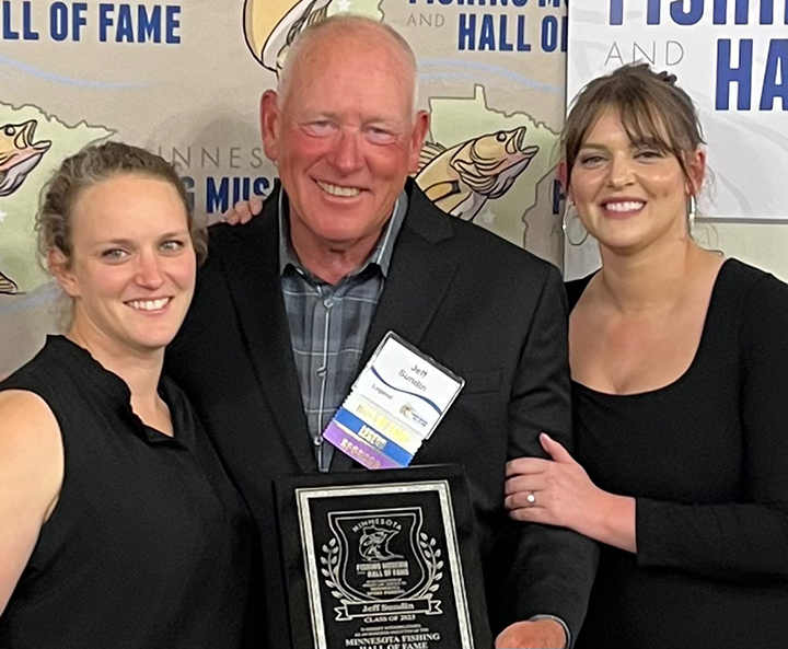 image of Jeff Sundin being awarded with plaque at the Minnesota Fishing  Hall of Fame induction 