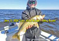 image of young man holding large walleye he caught while on a charter fishing trip to Lake of the Woods 