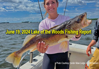 image of woman holding giant walleye she caught on the Border View Lodge fishing charter