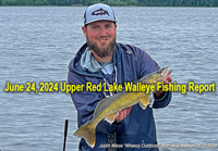 image of Justin Wiese holding a nice walleye caught on a Wheezy Outdoors fishing charter