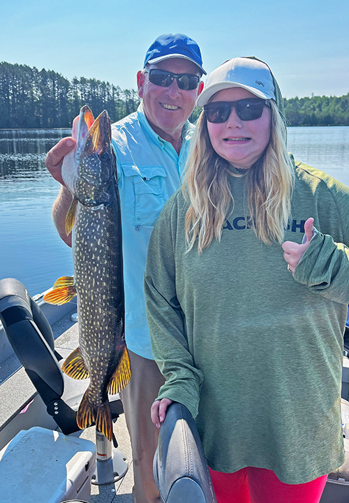 image of Joeshine Shouse with nice northern pike she caught near Grand Rapids