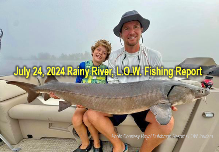 image of young bow and his father holding a huge sturgeon caught on the Rainy River