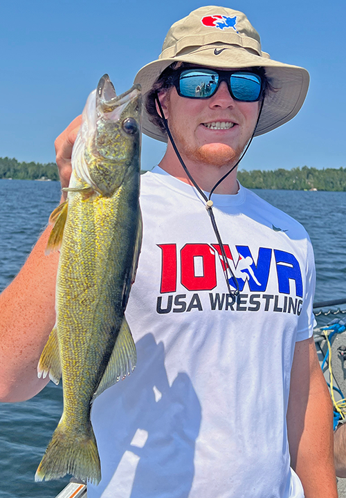 image of Miles Dea with big walleye caught in north central Minnesota