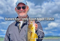 image of angler holding big walleye caught on a fishing charter with Joe Billiar