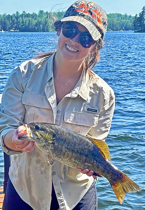 image of woman holding nice smallmouth bass