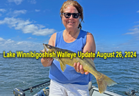 image of Suzy Klapmeir with walleye caught on lake Winnie links to fishing report