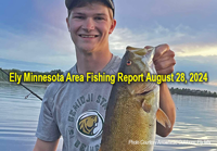 image of young man holding huge smallmouith bass links to fishing report from the Ely Minnesota region