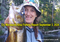 image of woman holding huge walleye caught in the Ely Minnesota region