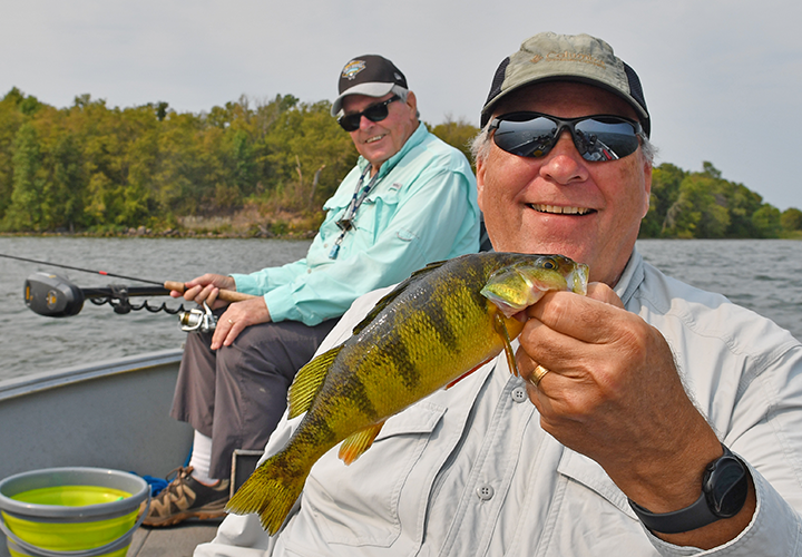 image of Paul Kautza with jumbo perch caught on Lake Winnie