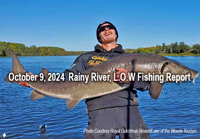 image of angler holding giant sturgeon he caught on the Rainy River