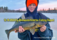 image of young man holding nice walleye he caught ice fishing