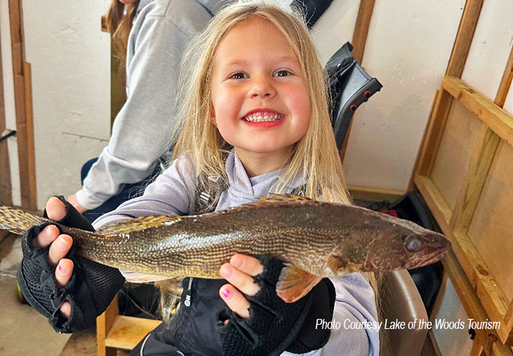 image of young girl with nice sauger caught on the Rainy River