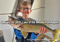 image of young ice fisherman holding big walleye caught on Lake of the Woods