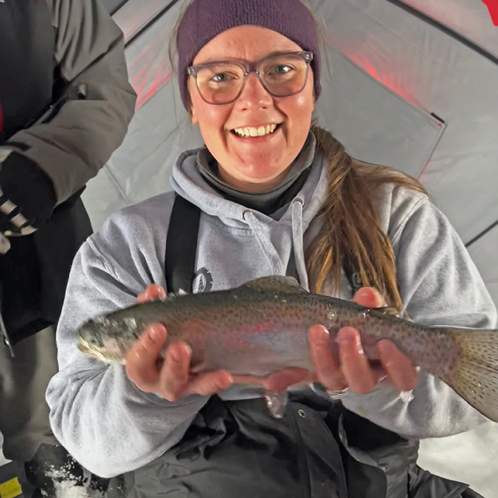 image of Joelle Bellamy holding nice rainbow trout caught near Grand Rapids MN