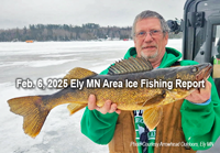 image of ice fisherman holding big walleye he caught in the Ely Minnesota region