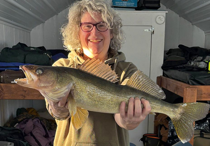 image of woman with nice walleye caught on lake of the woods