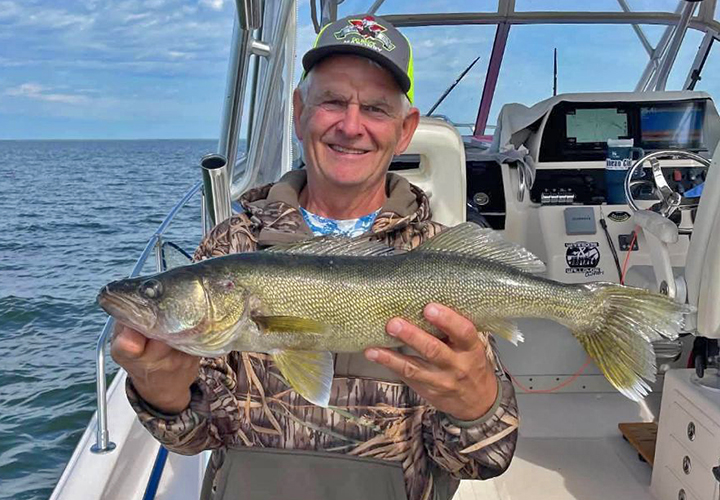 Angler on arnesen's fishing charter with a nice size walleye