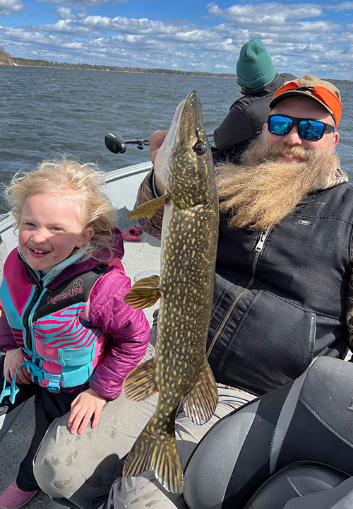 image of Audrey and Austin Jones with nice size Lake Bemidji northern Pike
