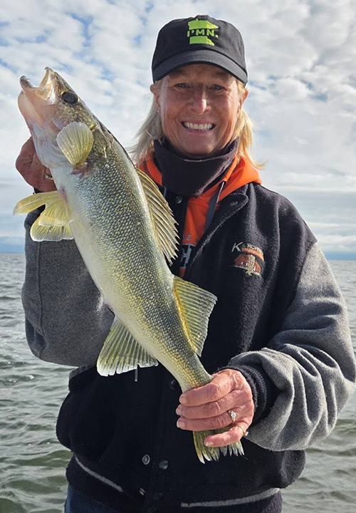 image of woman with a nice Lake of the Woods walleye caught on a Borderview Lodge fishing charter